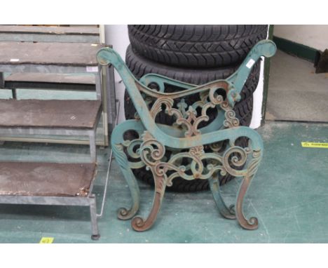 Pair of green metal bench ends