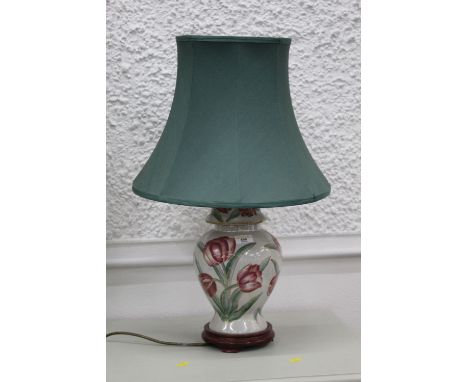 Floral decorated lamp with green shade