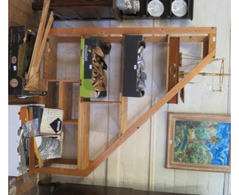 A pine shelf unit, with sloping side, 179cm high 148cm wide