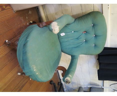 A Victorian open armchair, the button back on scroll arms and moulded cabriole legs with pot castors