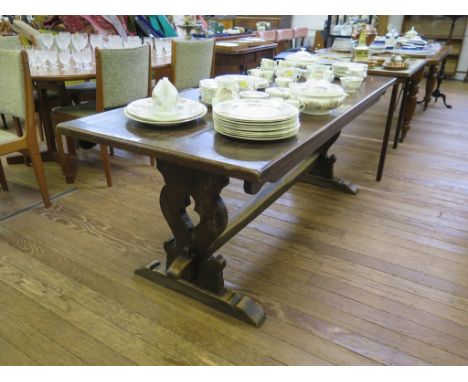 An oak refectory table, on baluster shaped fret carved supports and bracket feet, 77.5cm wide 184cm long