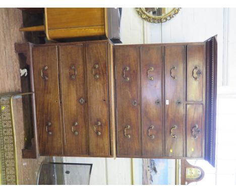 A George III mahogany chest on chest, the dentil cornice over two short and three long graduated drawers over a base with thr