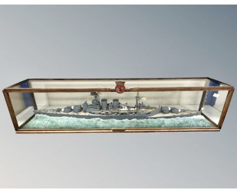 A hand built scale model of the British WWII battleship HMS Hood, in glazed display case, length 143 cm.