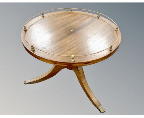 A reproduction mahogany tripod occasional table with gallery top, diameter 74 cm 