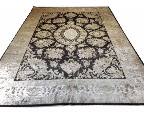 FINE PURE SILK ISPHAHAN DESIGN CARPET, 365cm x 268cm, central medallion on a floral noir field within complimentary bands and