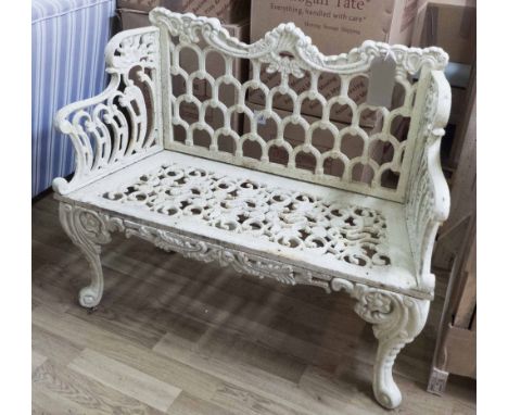 GARDEN BENCH, Victorian style cast iron of small proportions in a cream finish on swept supports, 105cm L x 87cm H.