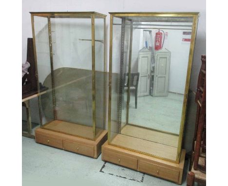 DISPLAY CABINETS, a pair, French Art Deco glazed with two base drawers brass and oak shelf (one lacking supports) one with mi