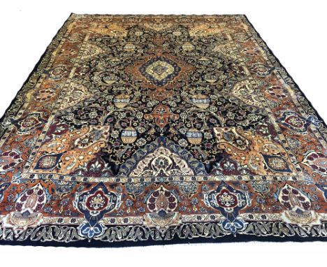 FINE PERSIAN KASHMAR CARPET, 393cm x 295cm, central pendant medallion on a midnight blue palmette and vine field within compl