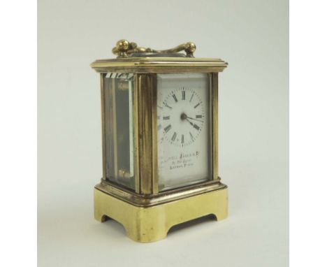 MINIATURE HOWELL JAMES & CO. CARRIAGE CLOCK, with brass case, French movement, 4.5cm W x 4cm D x 6.5cm H, with original fitte