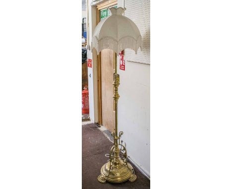 STANDARD LAMP, Edwardian brass with cream silk and tassled shade, 177cm H.