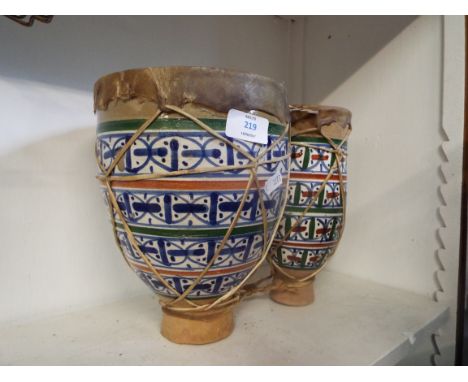 A set of ceramic drums with painted decoration