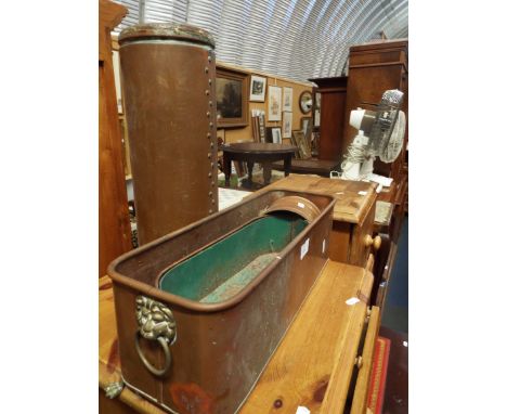 A copper stick stand together with two copper and brass troughs and a copper jardiniere
