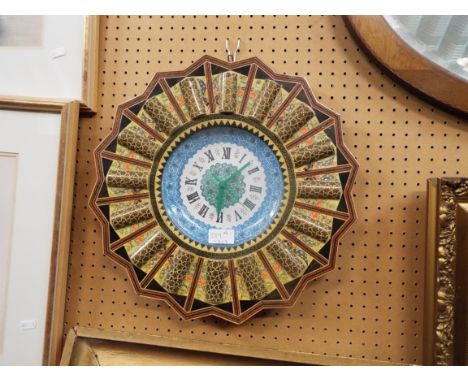 A kitsch star shaped Sorrento ware style clock 