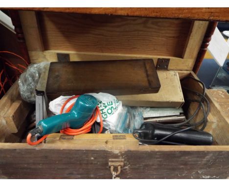 A vintage pine tool chest housing an electric sander, jigsaw & drill, taps and dies etc