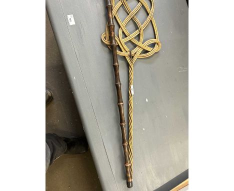 A carpet beater and a walking stick