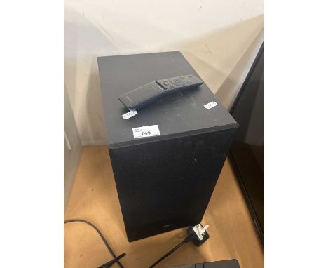 A Samsung speaker and remote control