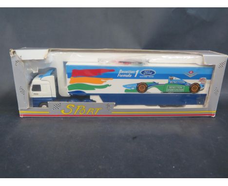 An Eligor 5414 Scania Ford Benetton F1 Team Transporter 1/43 Scale. Model has small mark, box battered 