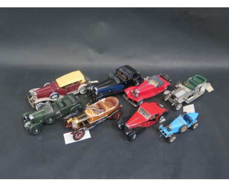 Eight Franklin Mint 1:24 Scale Cars Including Bugattis, Mercedes, Duesenberg, Bentley and Rolls-Royce. All have been displaye