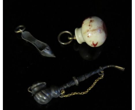 A 19th Century Japanese Painted Bone Charm, slipper charm and miniature pipe 