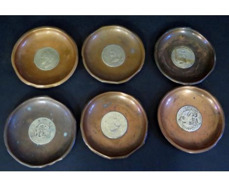 A Set of Six Silver Coin Set Ashtrays including American 1877 Dollar, Chinese, Japanese, Nederlands, etc. 