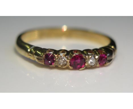 An 18ct Yellow Gold, Ruby and Diamond Five Stone Ring, c. 3mm central stone, size O.5, 3.1g 