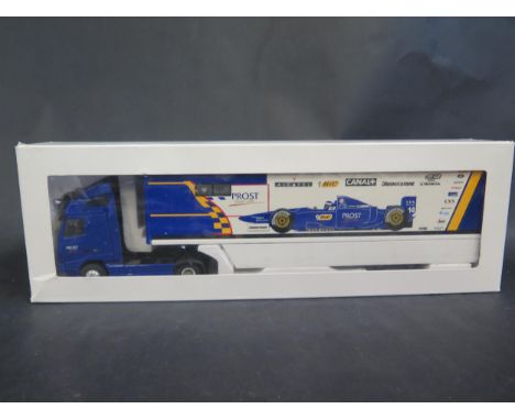 An Eligor 11 Volvo FH12 Prost F1 Team Transporter 1/43 Scale. Model missing mirrors and detailing parts, some marks, wrong bo