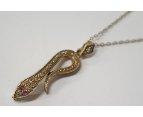 A 9ct Gold, Diamond and Ruby Snake Pendant (38mm drop) on an 18" 9ct gold chain, 3g 