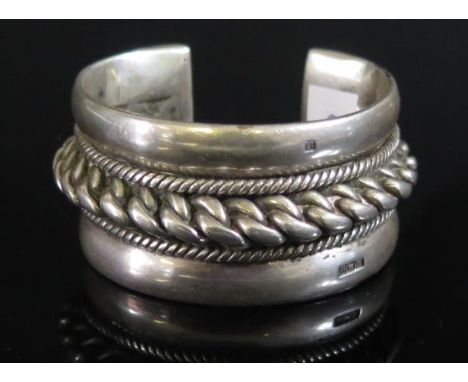 A Heavy Egyptian Silver Torque Bangle, 57mm wide, 157g 