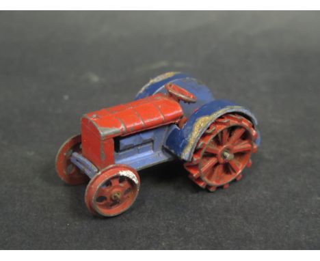 A Dinky 22e Farm Tractor, Red wheels and body, blue chassis 