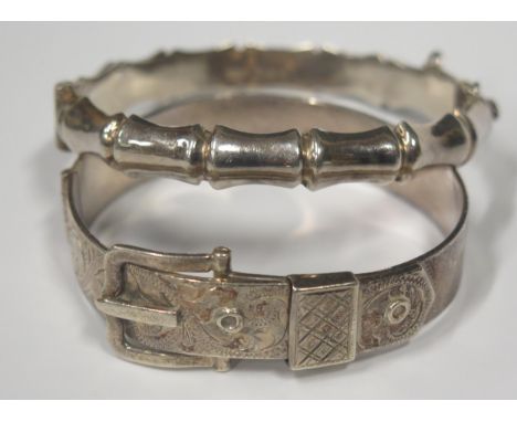 A Hallmarked Sterling Silver Hinged Buckle Bangle and one other hallmarked silver hinged bangle, 48.3g 