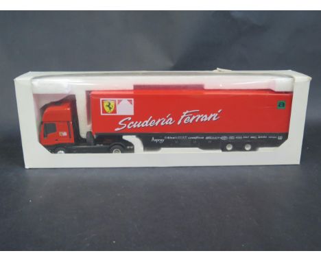 An Eligor 11135 Iveco Ferrari Eurostar 1998 F1 Team Transporter 1/43 Scale. Model has some loose parts, missing one mirror an