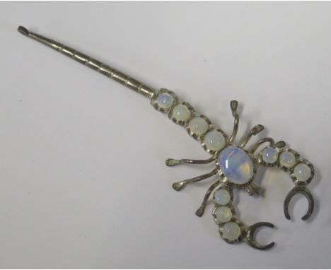 A Silver and White Opal Scorpion Brooch, 85mm long 