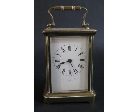 French Carriage Clock.  White enamelled face (AF), with feint makers mark '....... &amp; Sons, Paris'.  11cm tall. 