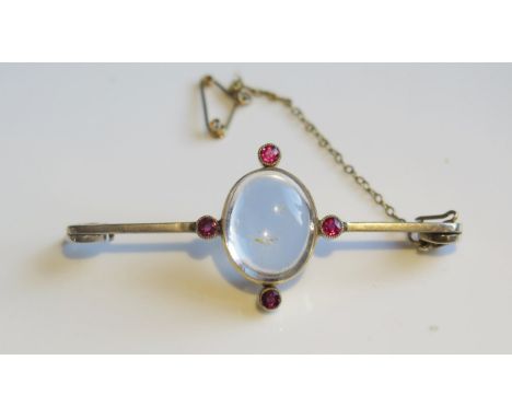 A Ruby and Crystal Brooch in an unmarked gold setting, 56mm, 6.2g. Pin missing 