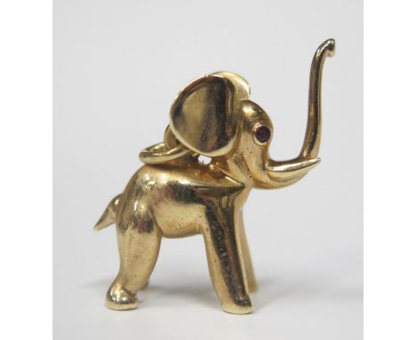 A Hallmarked 9ct Gold Elephant Pendant with ruby set eyes, 32mm tall, 21.3g 