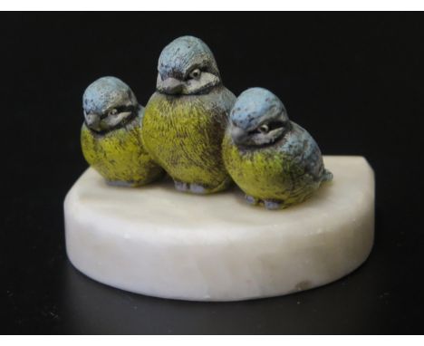 A Cold Painted Bronze Group modelled as three blue tits on a soapstone base, 8wm wide 