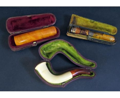 Three Cheroot Holders (two cased, on silver banded one 9ct gold collar) and cased Meerschaum pipe 