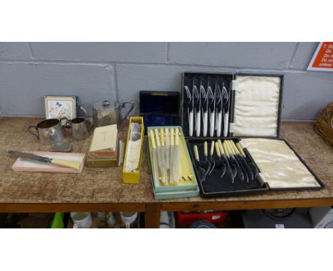 A collection of flatware, a three piece plated tea service, a jewellery box, a prayer book, etc. **PLEASE NOTE THIS LOT IS NO