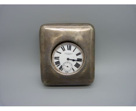 A silver fronted travel pocket watch case and pocket watch, the dial marked C. Packer &amp; Co., 76/78 Regent St., London W, 