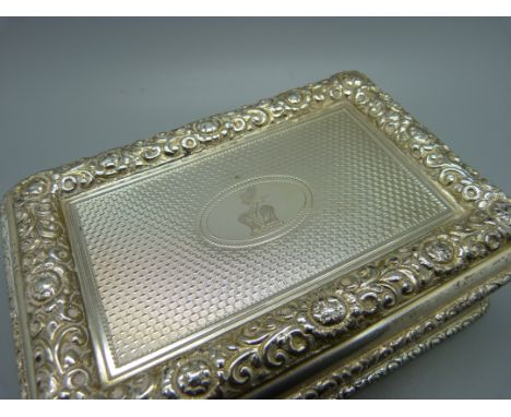 A silver cigarette box, London 1921, C J Vander, total weight 671g, 14.5cm wide