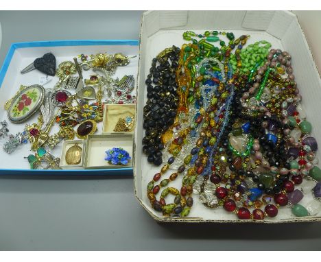 Vintage bead necklaces and costume brooches