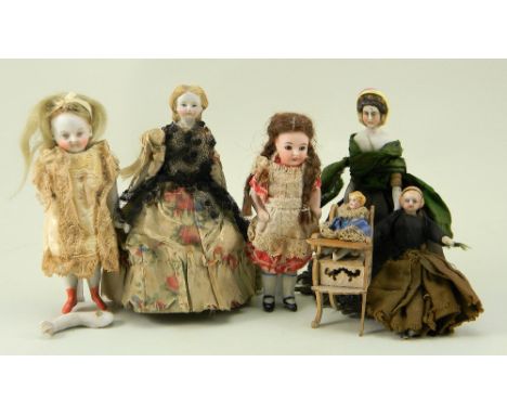 Collection of six dolls house dolls, German 19th century, including an early parian type lady with painted features, moulded 