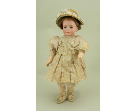 Rare Bruno Schmidt 2033 ‘Wendy’ bisque head character doll, German circa 1909, the fine pale bisque head with weighted brown 