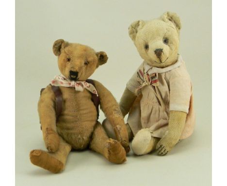 A small Steiff Teddy bear, German circa 1909, with button to left ear, straw filled bear with remains of brown mohair, glass 