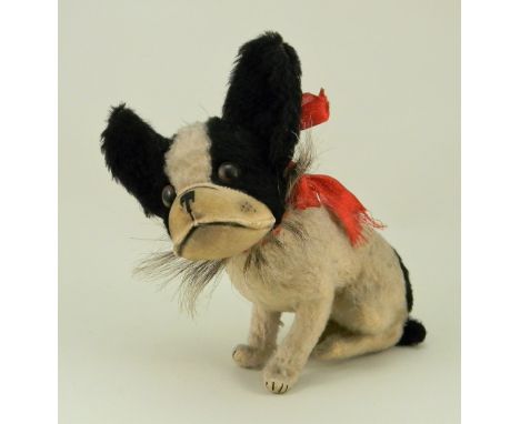 A Steiff mohair seated Bully Bulldog, circa 1930, with black and white mohair, brown glass eyes, velvet muzzle with stitched 