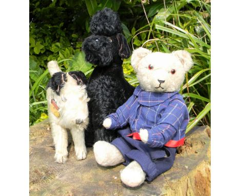 Two Steiff toy dogs and a Hermann Teddy bear, 1950s, white and black mohair Fox Terrier, brown glass eyes, stitched nose, mou