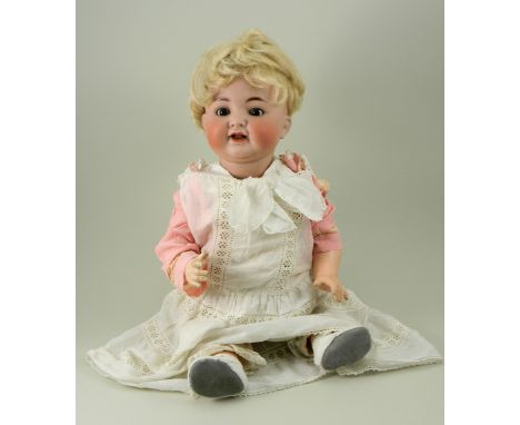 Simon &amp; Halbig/K&amp;R 126 bisque head baby doll, German circa 1910, with weighted brown glass eyes, painted lashes, feat