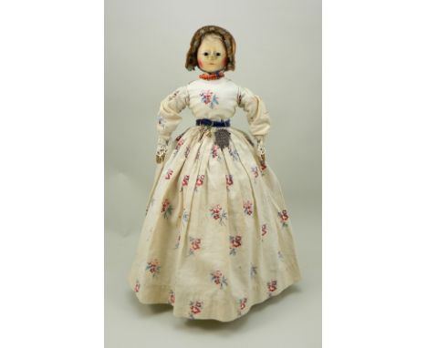 Early George II carved and painted wooden doll, English circa 1750, the painted gesso face with inserted black pupil-less eye