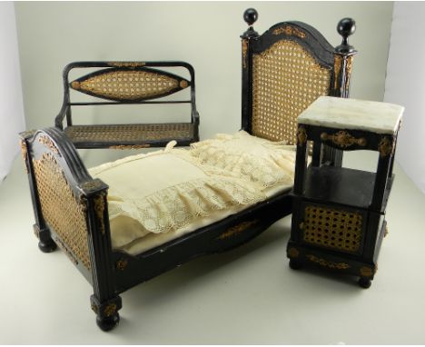 Dolls bedroom furniture, probably French circa 1880, comprising bed, side table and settee, the wooden framed furniture paint