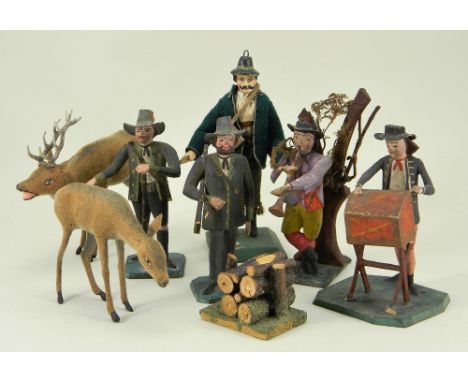 Four rare German hand painted carved wooden figures of Huntsmen and Travelling Musicians, circa 1870, two rifle bearing hunts